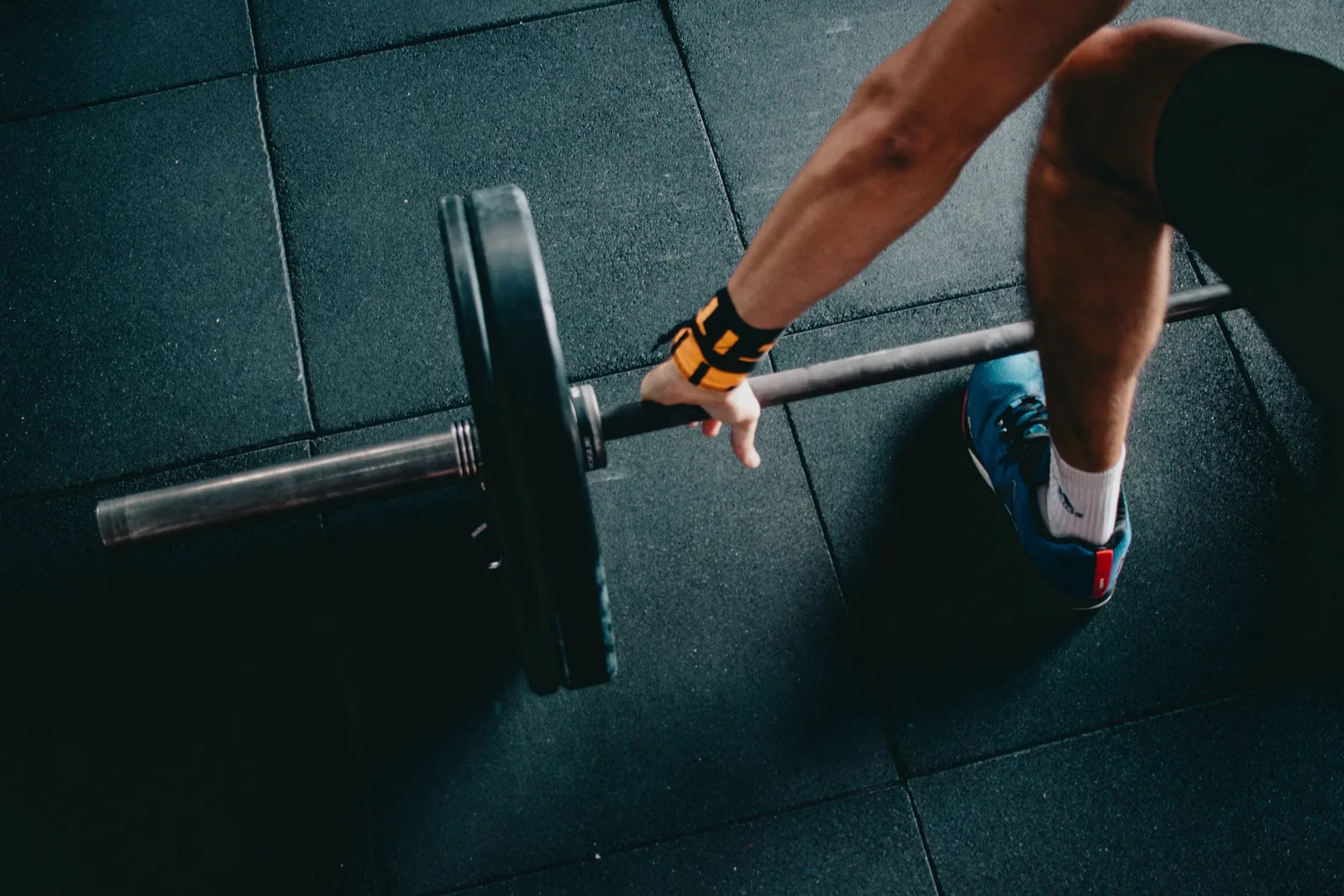 Hands gripping a barbell before a lift