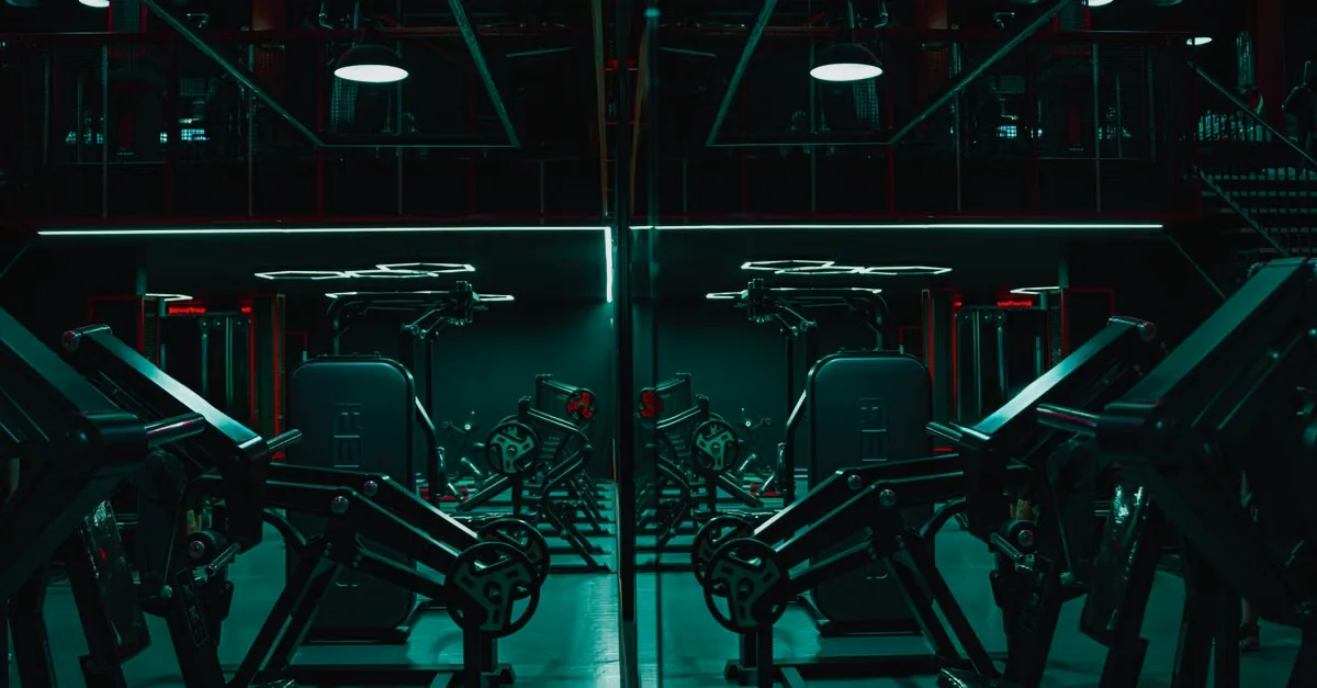 Gym floor with weights and overhead lighting