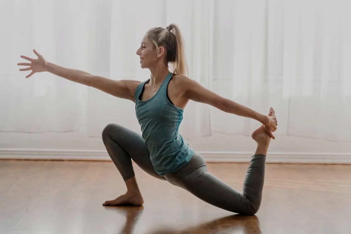 Member stretching on a mat