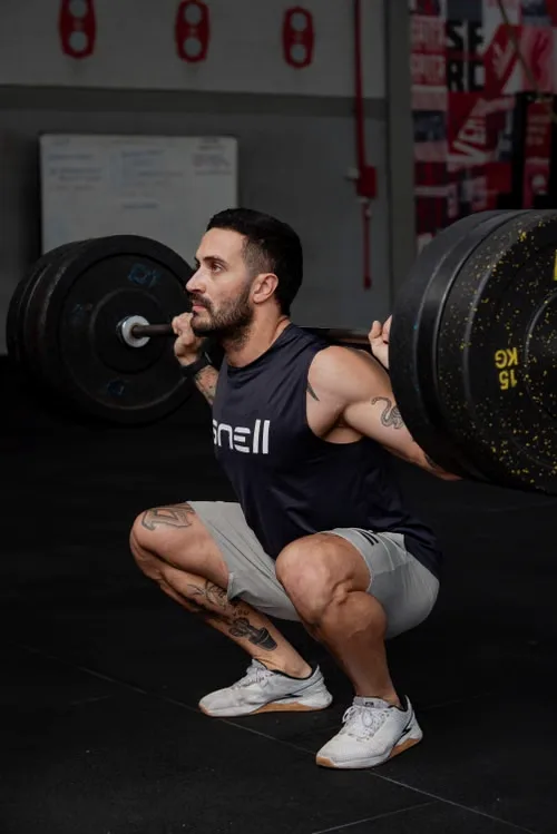 Athlete performing a barbell squat